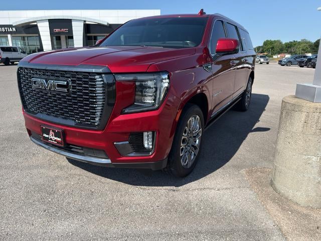 2023 GMC Yukon XL Denali Ultimate in Volcanic Red Tintcoat — front three-quarter view
